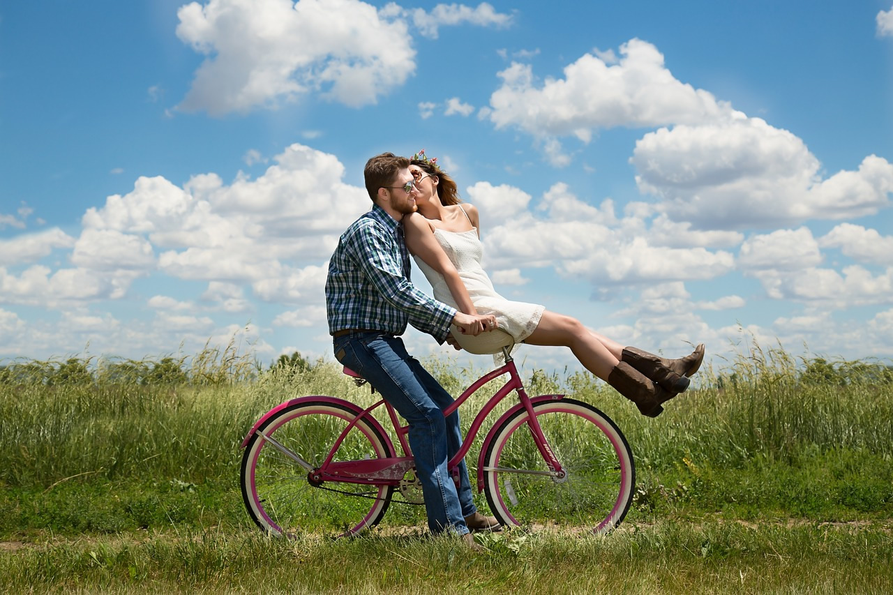 couple riding bicycle