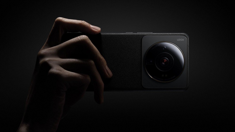 The Xiaomi 13 Pro is seen in detail with a large Leica camera